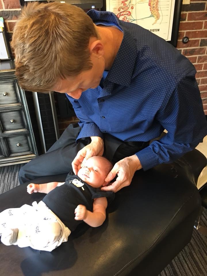 doctor adjusts baby